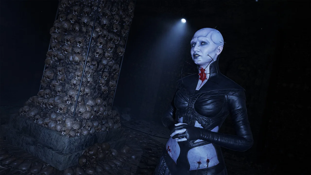 A pale woman in black leather with a wound at her throat stands beside a pillar built of skulls